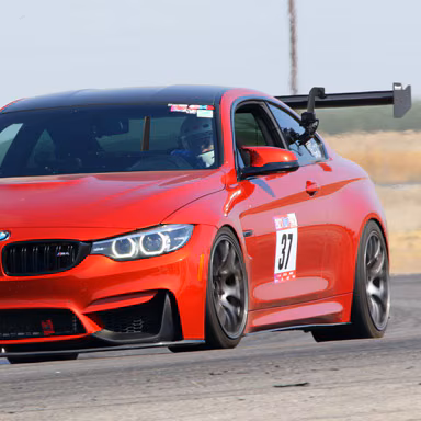 BimmerWorld-GTMore-Swan-Neck-Wing-F82-M4-sakhir-blakes-garage-front-sm.jpg